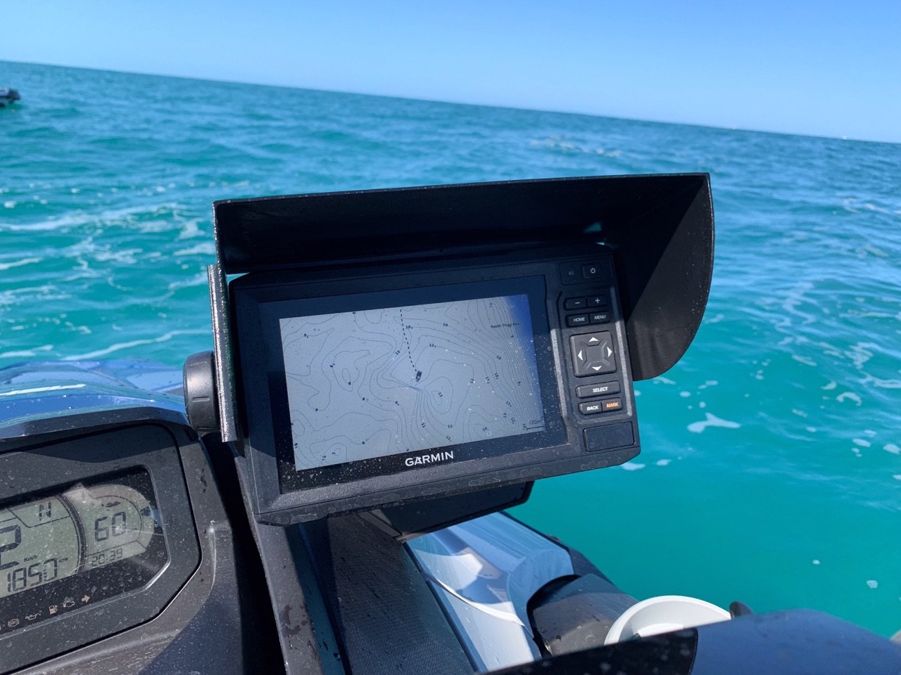 Sea-Doo FishPro personal watercraft on calm turquoise offshore water