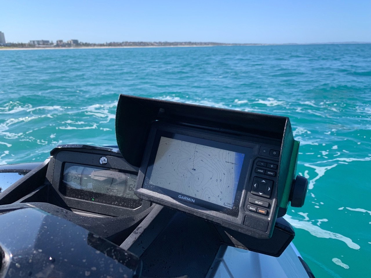 Garmin fish-finder mounted on a Sea-Doo on turquoise water