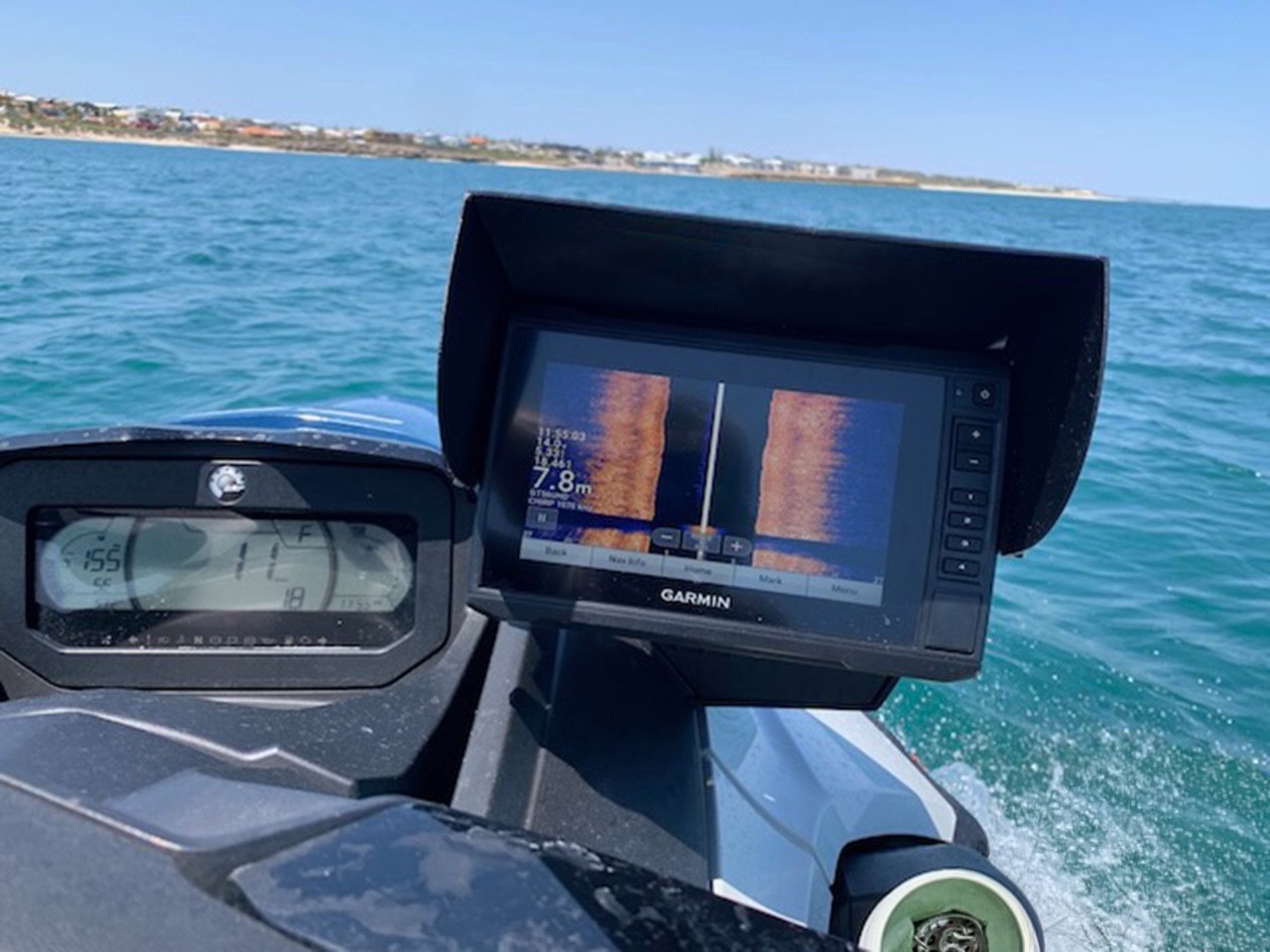 Black JetSkiVisor with orange stock artwork fitted on a Garmin fish finder